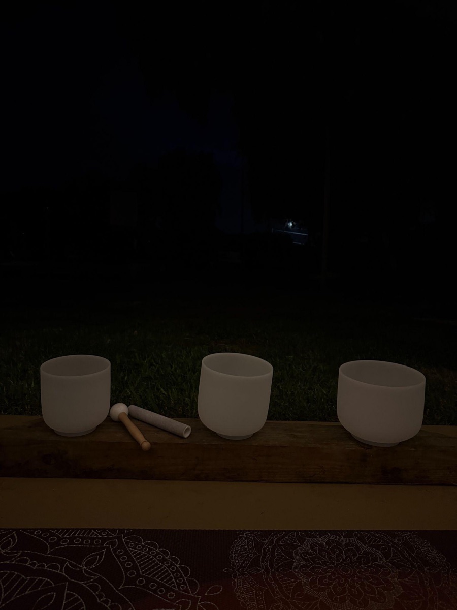 Crystal singing bowls glowing at night